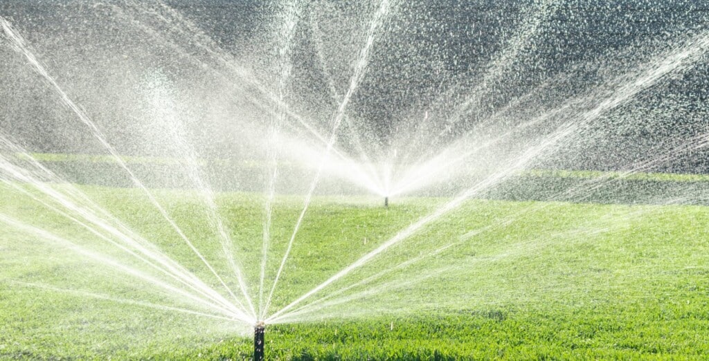 Why hire a professional to turn on sprinkler system in the Spring